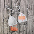 White crochet bikini top with sizing measurements displayed on a rustic wooden background