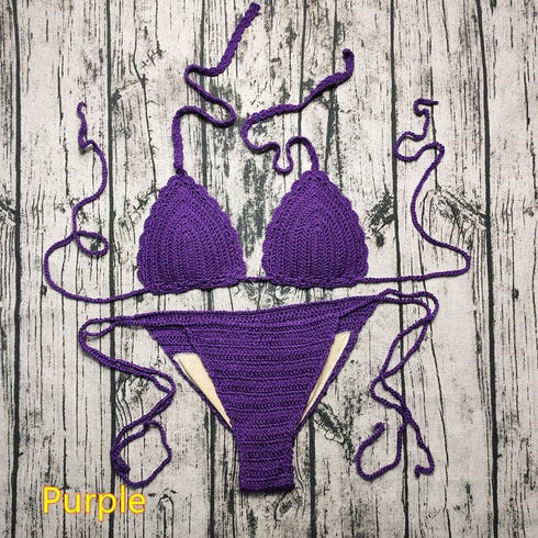 Purple crochet bikini set with tie straps on rustic wooden background
