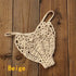 Beige crochet bikini bottom with floral lace pattern on wooden background
