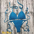 Sky blue crochet bikini set with adjustable ties on rustic wooden background