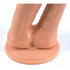 Close-up of a realistic silicone novelty product with a round base on a white surface.