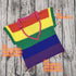 Colorful crochet rainbow striped knit crop top with size measurements on wood background