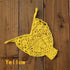 Yellow crochet bikini top with floral pattern on rustic wooden background