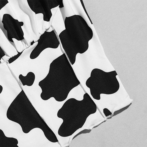Black and white cow print bikini fabric with ruched and stitched details