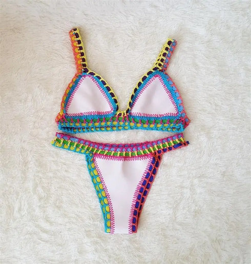 Colorful crochet trim bikini set with triangle top and high-cut bottoms on a soft white background