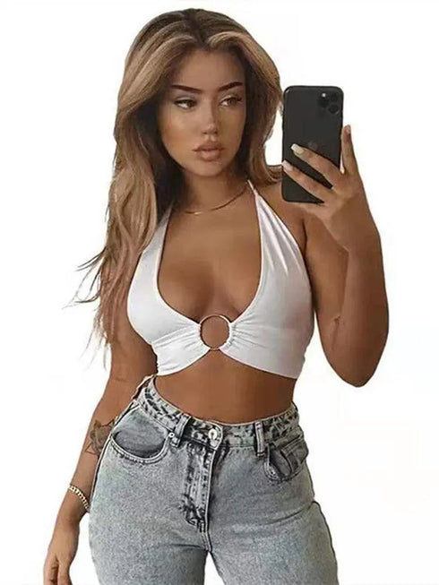 Woman in white bikini halter top with ring detail, light wash jeans, taking mirror selfie