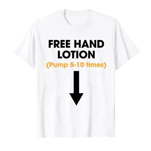 A white short-sleeve crewneck t-shirt with a humorous graphic print reading 'FREE HAND LOTION (Pump 5-10 times)' in black and orange text, accompanied by a large black arrow pointing downwards.