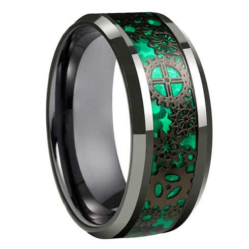 Ring with green and black intricate design on a white background