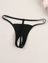 Black thong on a light beige background