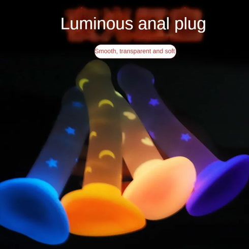 Colorful luminous anal plug with text on a dark background