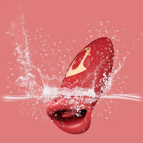 Red waterproof personal massager with gold detail splashing in water on pink background